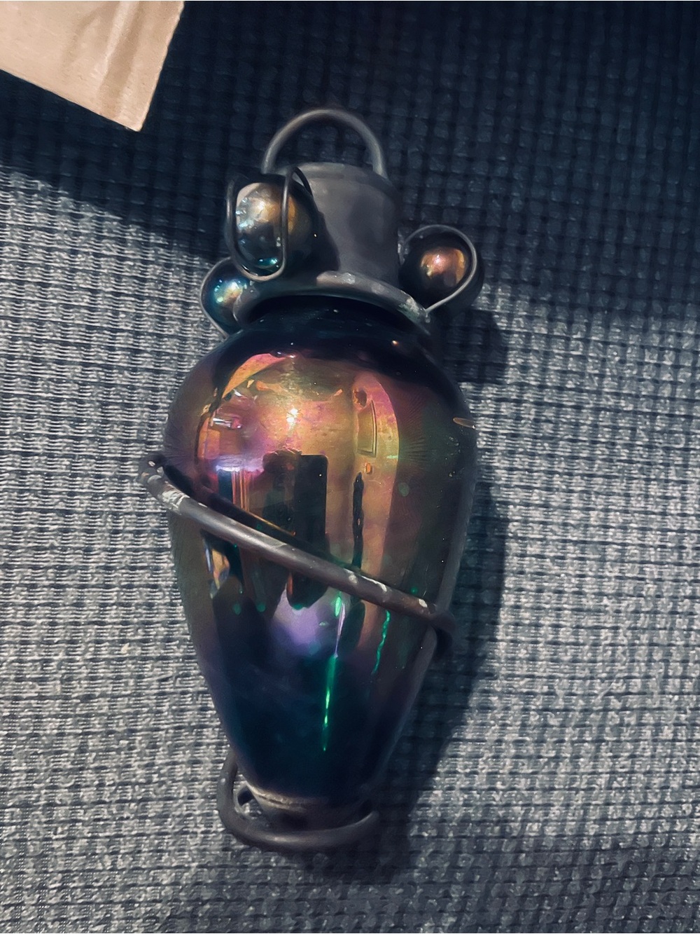 iridescent, pear-shaped or bulbous art glass & Metal hang Outside 9”